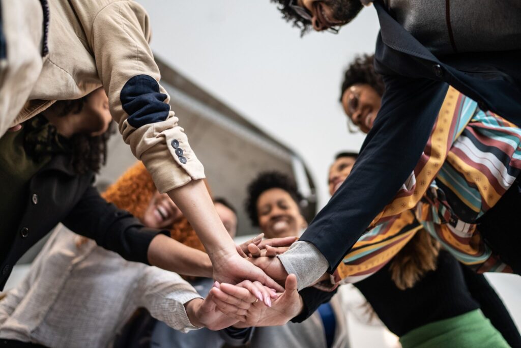 6 people in a circle hands together